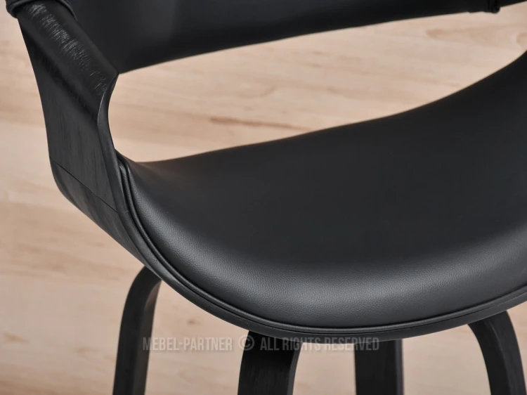 Detailaufnahme der hochwertigen Polsterung eines schwarzen Barhockers.