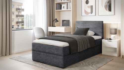 Modernes dunkelgraues Boxspringbett in geschmackvollem Schlafzimmer.
