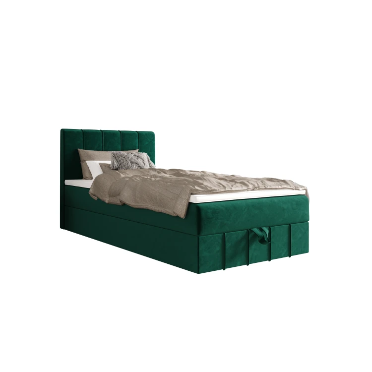 Grünes Boxspringbett aus Samt mit Matratze und Kissen.