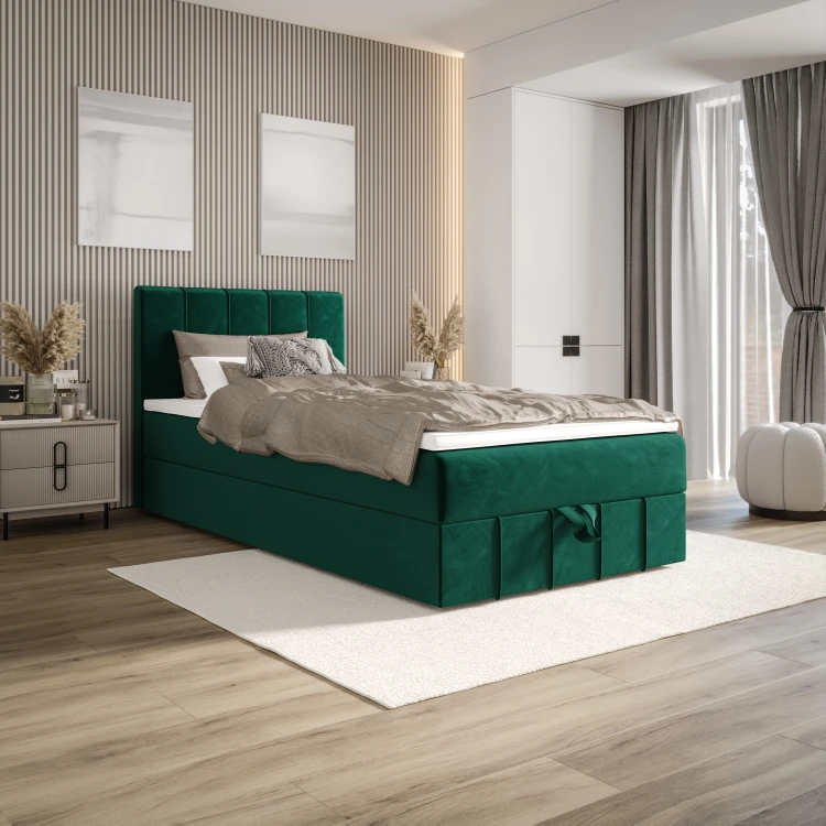 Perspektivische Ansicht eines grünen Boxspringbettes im Raum.