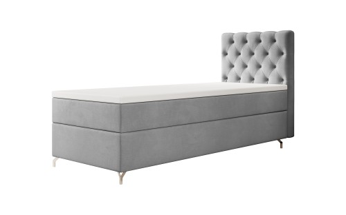 Elegantes graues Boxspringbett mit Chesterfield-Steppung am Kopfteil auf weißem Hintergrund.