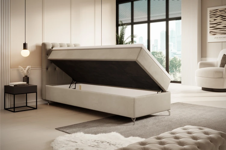 Seitlich aufklappbares Boxspringbett in Beige mit geräumigem Staufach.