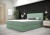 Mintgrünes Boxspringbett mit gestepptem Kopfteil als Blickfang im modernen Schlafzimmer.