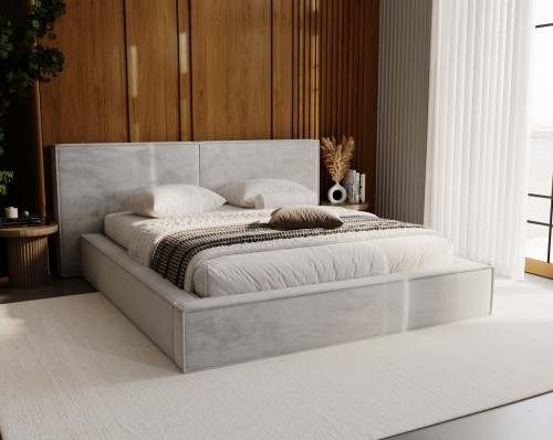 Hellgraues Polsterbett im modernen Design vor einer edlen Holzvertäfelung im Schlafzimmer.
